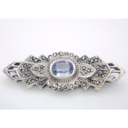 691 - An Exquisite Design Sterling Silver and Topaz Art Deco style Brooch. 5cm Wide. Gross Weight 8.88 Gra... 