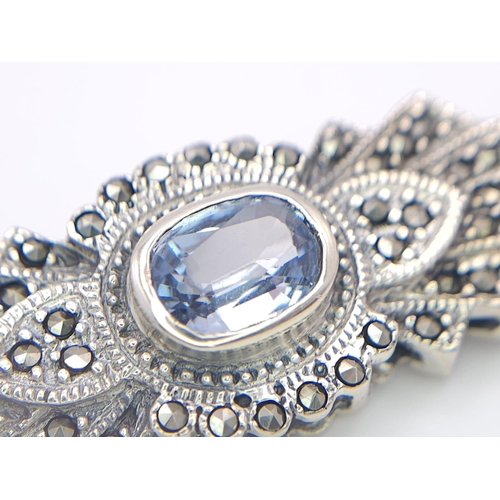 691 - An Exquisite Design Sterling Silver and Topaz Art Deco style Brooch. 5cm Wide. Gross Weight 8.88 Gra... 