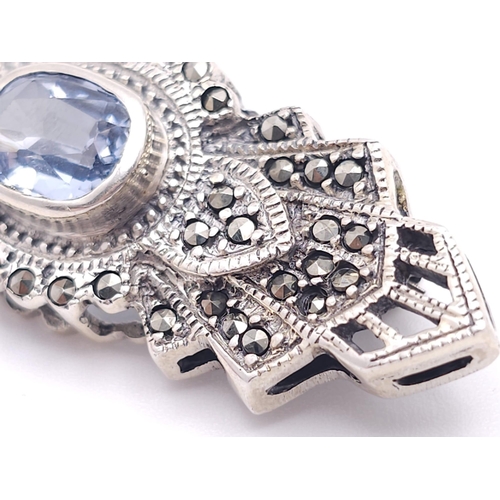 691 - An Exquisite Design Sterling Silver and Topaz Art Deco style Brooch. 5cm Wide. Gross Weight 8.88 Gra... 