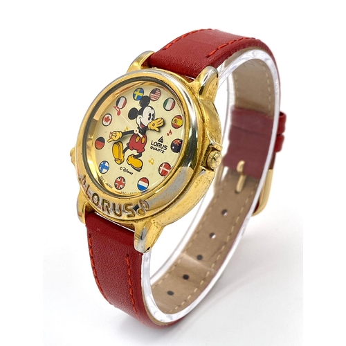 864 - A Lorus Quartz Mickey Mouse Watch. Red leather strap. Gilded case - 34mm. Mickey dial. In working or... 