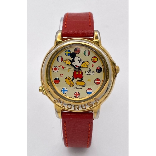 864 - A Lorus Quartz Mickey Mouse Watch. Red leather strap. Gilded case - 34mm. Mickey dial. In working or... 