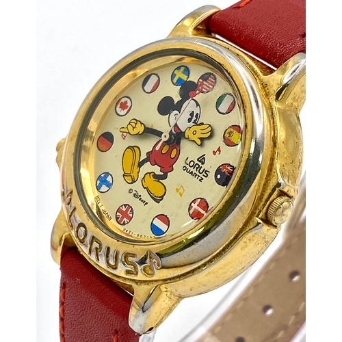 864 - A Lorus Quartz Mickey Mouse Watch. Red leather strap. Gilded case - 34mm. Mickey dial. In working or... 