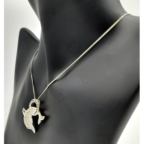 872 - An Unworn Sterling Silver Stone Set Dolphin Pendant Necklace in Presentation Box. 46cm Length. Penda... 