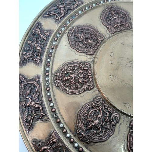 1032 - VINTAGE INDIAN BRASS WITH COPPER INLAY TRAY FEATURING MANY HINDU GODS .   50cms DIAMETER