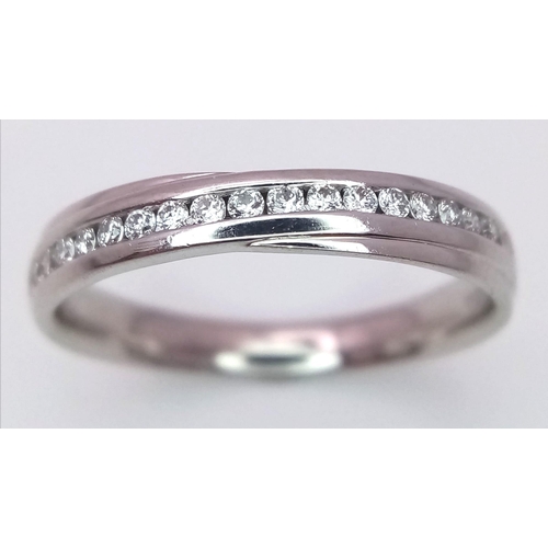 516 - 18K WHITE GOLD DIAMOND CHANNEL SET BAND RING, APPROX 0.20CT DIAMONDS, WEIGHT 2.6G SIZE N