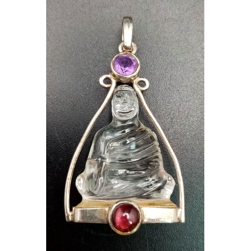 837 - A Silver Mounted Carved Crystal, Ruby and Amethyst Buddha/Deity Pendant, 4.5cm Length. Gross Weight ... 