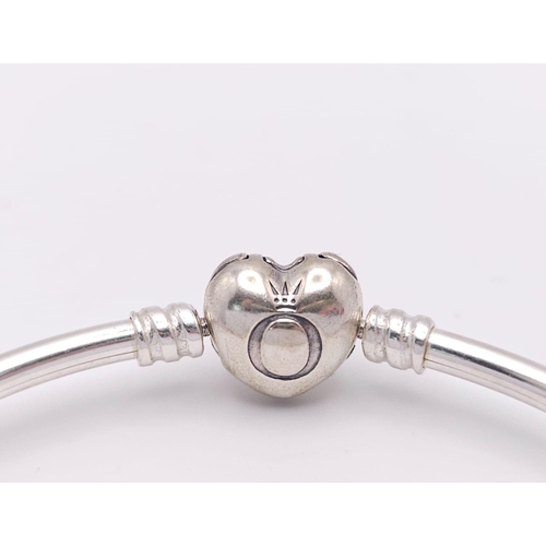 555 - A PANDORA - Moments sterling silver bangle, weight: 8.9 G.