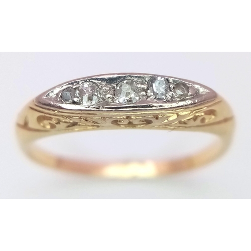 635 - An antique yellow gold (tests 18 K) ring with  a band of five old cut diamonds resting on a hand-car... 