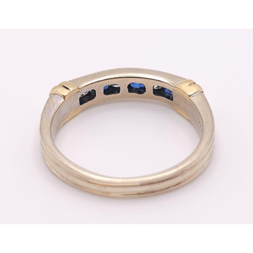 642 - An 18 K yellow gold ring with alternating blue sapphires and diamonds. Size: K, weight: 3.2 g.