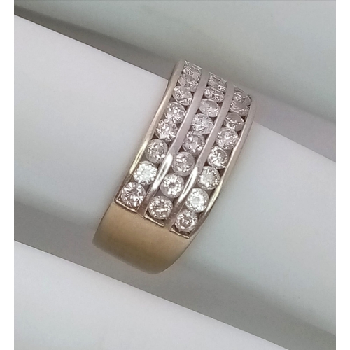 747 - A well made 18 K yellow gold ring with three channels filled with round cut diamonds. Size: H, weigh... 