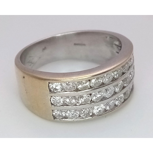 747 - A well made 18 K yellow gold ring with three channels filled with round cut diamonds. Size: H, weigh... 