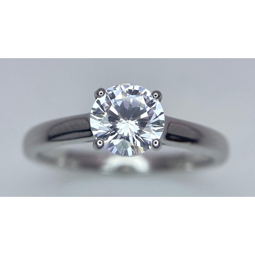 782 - A sterling silver solitaire ring with a round cut cubic zirconium. Size: N, weight: 2 g.