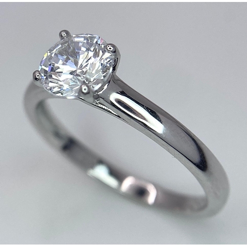 782 - A sterling silver solitaire ring with a round cut cubic zirconium. Size: N, weight: 2 g.