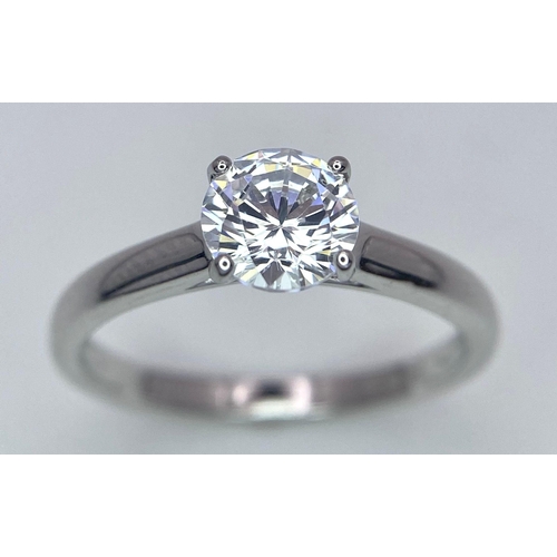 782 - A sterling silver solitaire ring with a round cut cubic zirconium. Size: N, weight: 2 g.