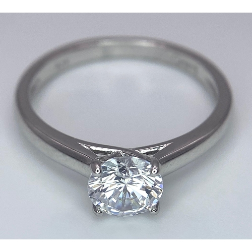 782 - A sterling silver solitaire ring with a round cut cubic zirconium. Size: N, weight: 2 g.