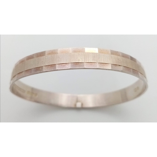 877 - A vintage sterling silver bangle (A/F). Full Birmingham hallmarks, 1979. Total weight 16.45G. Diamet... 