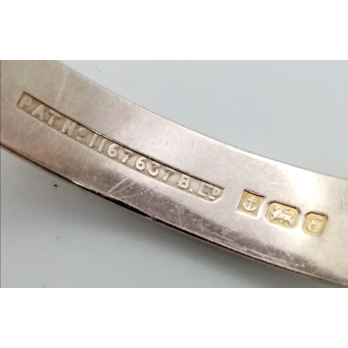 877 - A vintage sterling silver bangle (A/F). Full Birmingham hallmarks, 1979. Total weight 16.45G. Diamet... 