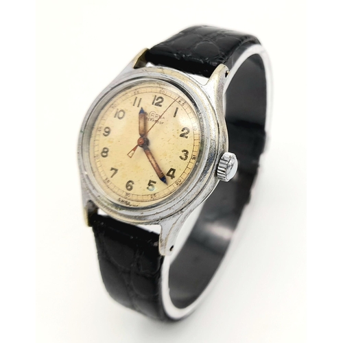 928 - A Vintage Incarna Mechanical Gents Watch. Black leather strap. Stainless steel case - 30mm. Aged dia... 