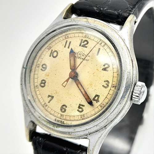 928 - A Vintage Incarna Mechanical Gents Watch. Black leather strap. Stainless steel case - 30mm. Aged dia... 