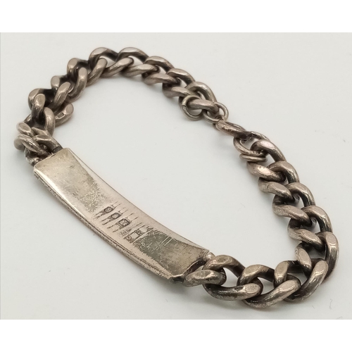 983 - A vintage sterling silver ID bracelet. Full hallmarks London, 1968. Total weight 27G. Total length 1... 