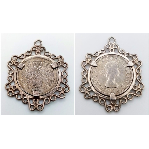 1063 - STERLING SILVER COIN MOUNT PENDANT WITH A SIX PENCE SET INSIDE, WEIGHT 5.5G