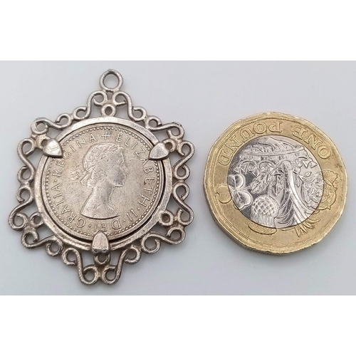 1063 - STERLING SILVER COIN MOUNT PENDANT WITH A SIX PENCE SET INSIDE, WEIGHT 5.5G