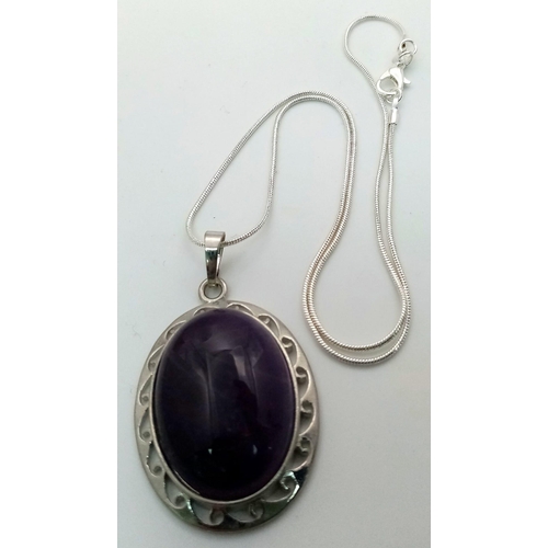 1078 - An Amethyst Oval Pendant on a 925 Silver Necklace. 5cm and 42cm.