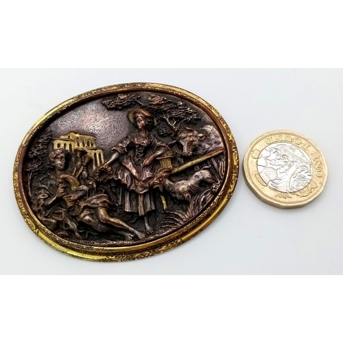 646 - An Antique Bronze, Brass and Mother of Pearl Brooch. Brass and mop foundations with a decorative rel... 