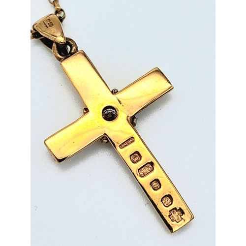 656 - A 9 K yellow cross with a single round cut diamond on a 41 cm long 9 K gold chain. Cross dimensions:... 