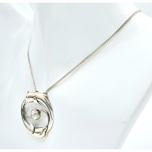 669 - A  985 Silver, Moonstone Set Leaping Dolphin Pendant
Necklace. Pendant Measures 3.6cm Length, Set wi... 