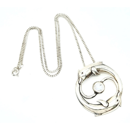 669 - A  985 Silver, Moonstone Set Leaping Dolphin Pendant
Necklace. Pendant Measures 3.6cm Length, Set wi... 