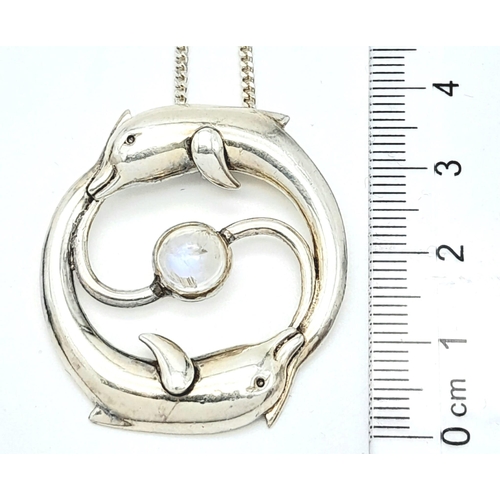 669 - A  985 Silver, Moonstone Set Leaping Dolphin Pendant
Necklace. Pendant Measures 3.6cm Length, Set wi... 