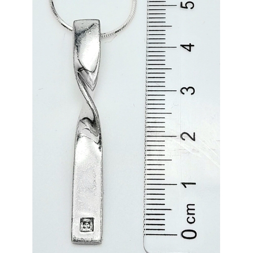 913 - A stylist 925 silver CZ pendant on sparkling Italy silver chain. Total weight 8.85G. Total length 62... 