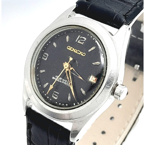 971 - A Vintage Genicko Gents Mechanical Watch. Black leather strap. Stainless steel case - 36mm. Black di... 