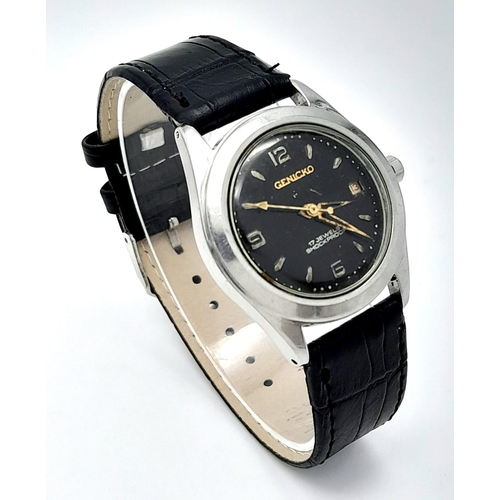 971 - A Vintage Genicko Gents Mechanical Watch. Black leather strap. Stainless steel case - 36mm. Black di... 