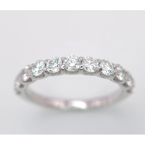 527 - An 18 K white gold half eternity ring with good quality brilliant cut diamonds. Size: O, weight: 2.9... 