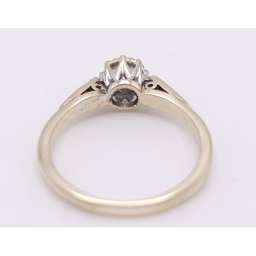 699 - 9K YELLOW GOLD SOLITAIRE DIAMOND RING, WITH FURTHER DECORATING DIAMONDS ON SHOULDERS, WEIGHT 2.2G SI... 