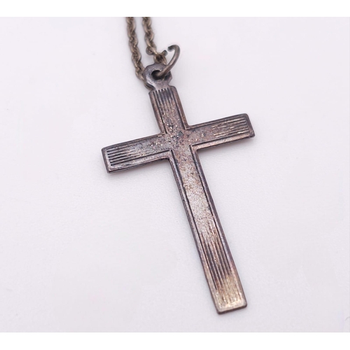 849 - A vintage sterling silver cross pendant on silver belcher chain. Total weight 3.7G. Total length 42c... 