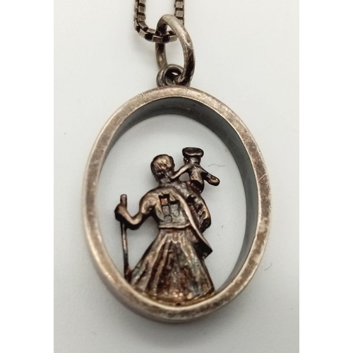 892 - A vintage sterling silver St Christopher pendant on silver box chain. Total weight 7.1G. Total lengt... 