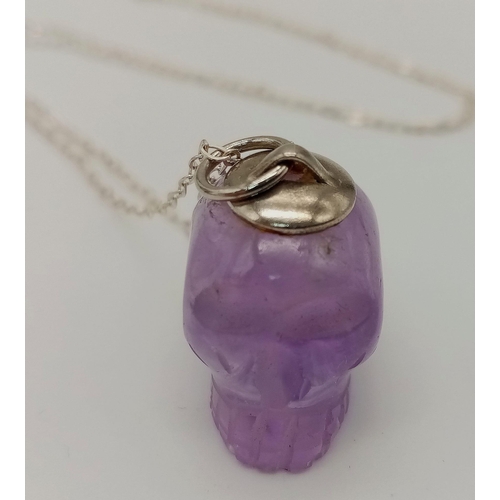 948 - A Sterling Silver Carved Amethyst Skull Pendant Necklace. 42cm Length. Pendant Measures 2cm Length. ... 