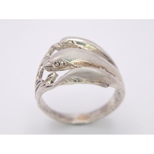 998 - A Unique Sterling Silver Leaping Dolphins Ring Size N. The Crown Measures 1.4cm Wide. The Ring Weigh... 