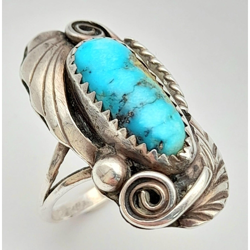 1009 - A native American silver ring with an elongate turquoise cabochon, size:  M weight: 4.2 g.