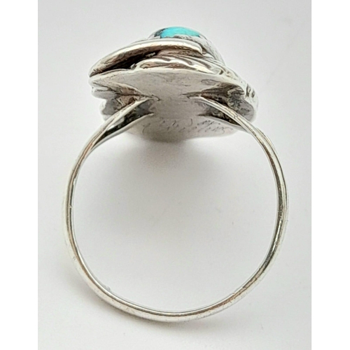 1009 - A native American silver ring with an elongate turquoise cabochon, size:  M weight: 4.2 g.