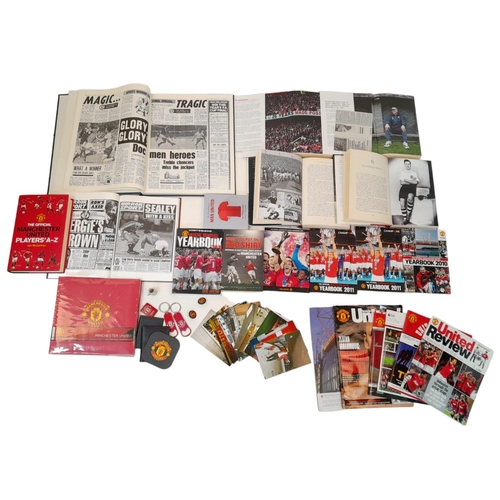 620 - A Potpourri of Manchester United Collectibles: Books, Pictures and Programmes. Over thirty items. Pl... 