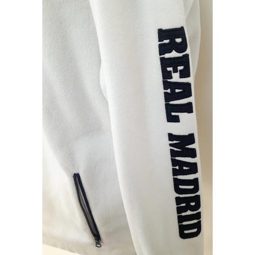 729 - Two Officially Licensed Real Madrid C.F. Jackets. White fleece - Large and padded sleeveless - XL. B... 