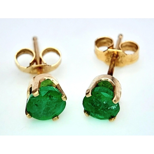 757 - A Pair of 9K Yellow Gold and Emerald Stud Earrings. 0.5g total weight.