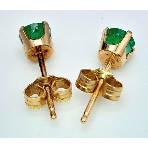 757 - A Pair of 9K Yellow Gold and Emerald Stud Earrings. 0.5g total weight.