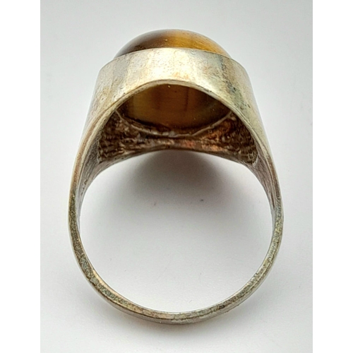 792 - A vintage sterling silver tiger eye solitaire ring with full London hallmarks, 1974. Total weight 7.... 