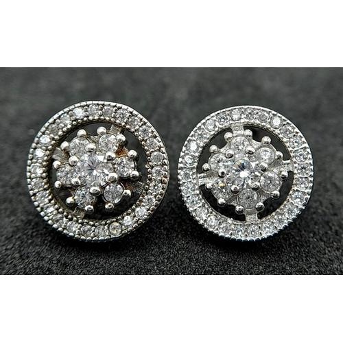 927 - 2X fancy pairs of 925 silver stone set floral cluster earrings. Total weight 3.85G.