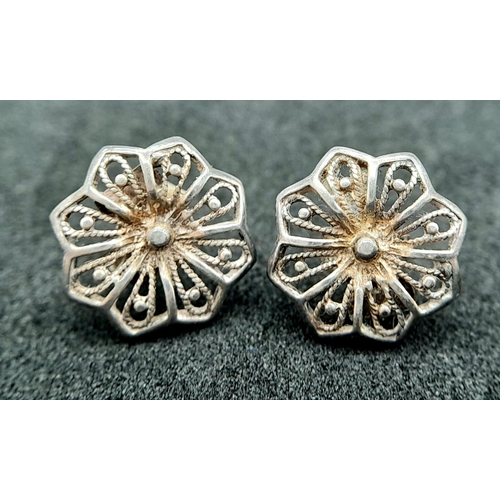 927 - 2X fancy pairs of 925 silver stone set floral cluster earrings. Total weight 3.85G.